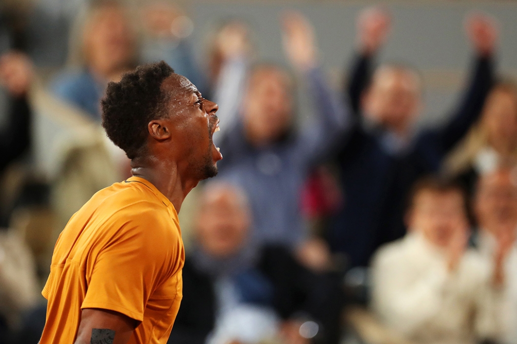 Gael Monfils celebrates against Sebastian Baez at Roland Garros